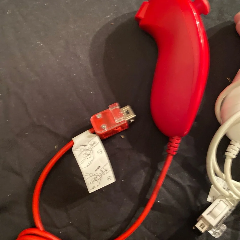 Nintendo Red and White Motion Nunchuk Controllers